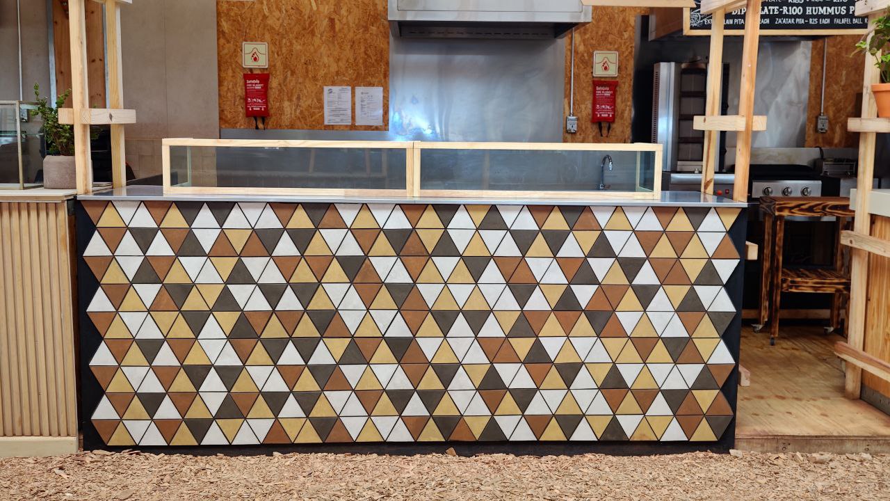 Close view of Mediterranean Samoosas triangle patterned stall counter